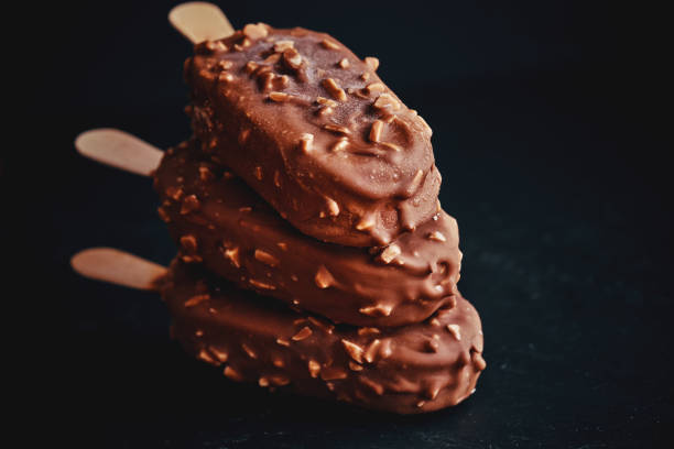 istock Vanilla Ice Cream with Chocolate on a Stick 959929844