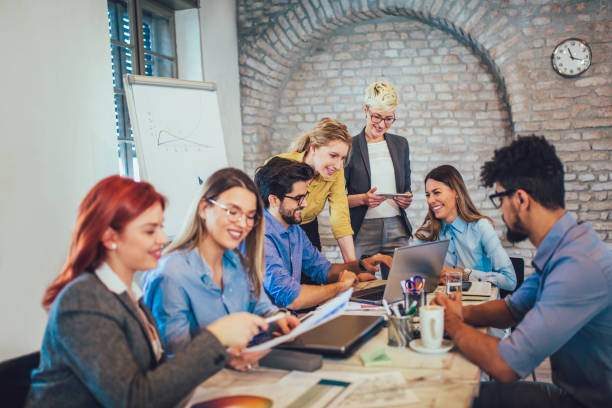 istock Business people working in office together. Team work in office. 959932264