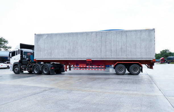 istock container trucks Logistic by Cargo truck on the road 959933864