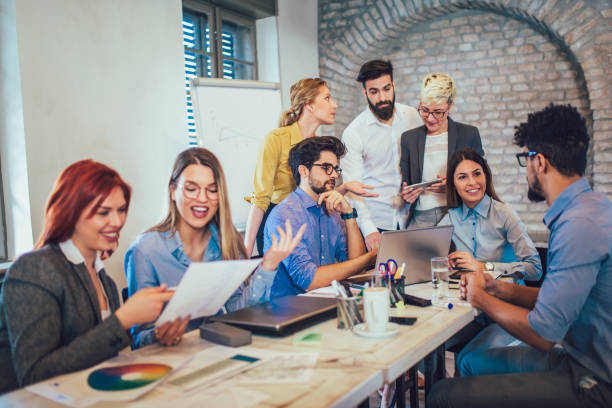 istock Business people working in office together. Team work in office. 959934452