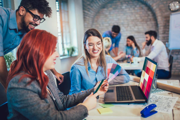 istock Business people working in office together. Team work in office. 959937598