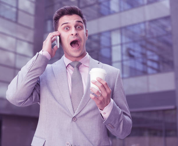 istock Surprised businessman talking on phone 959937672