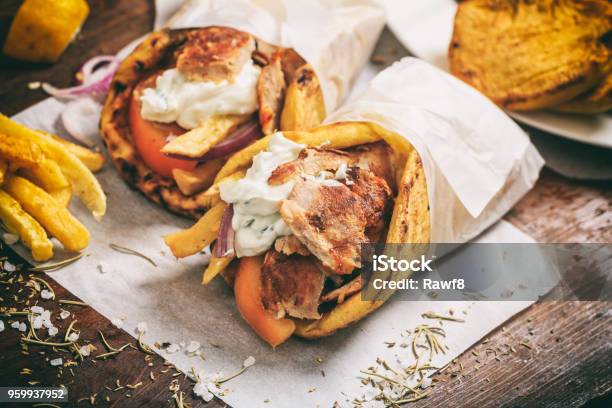 Greek Gyros Wraped In A Pita Bread On A Wooden Background Stock Photo - Download Image Now