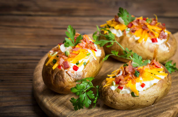 istock Baked potatoes with cheese and bacon 959938652