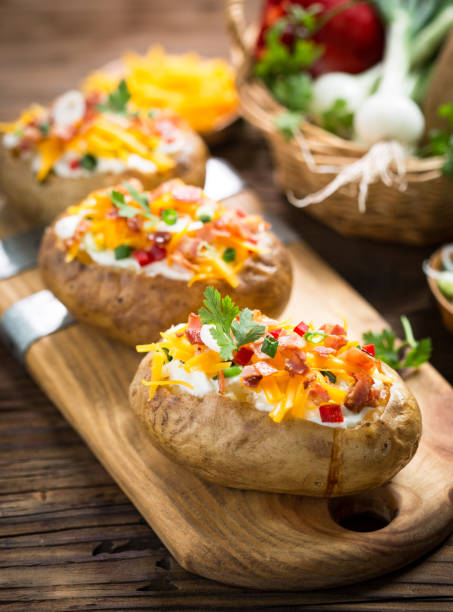istock Baked potatoes with cheese and bacon 959938674