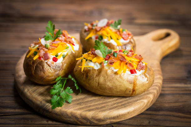 istock Baked potatoes with cheese and bacon 959938762