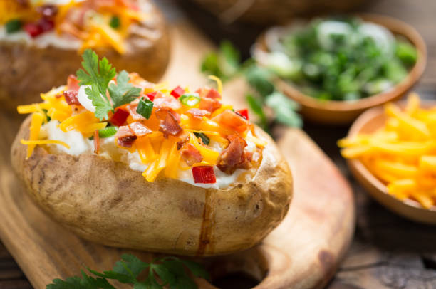 istock Baked potatoes with cheese and bacon 959938764