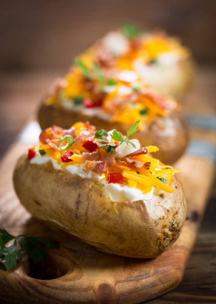 istock Baked potatoes with cheese and bacon 959938846