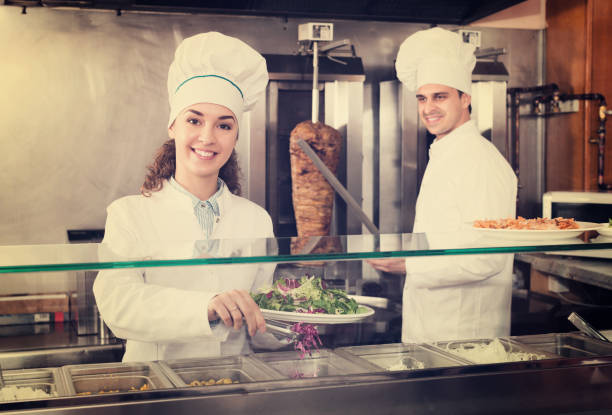 istock Staff posing at kebab counter 959939118