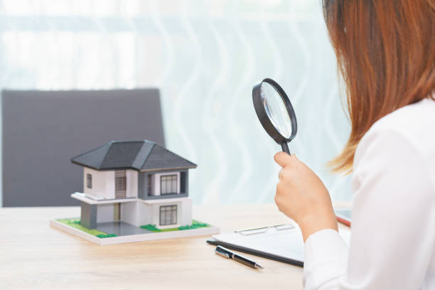 Smile woman searching for new home or inspecting homes before buying concept. stock photo