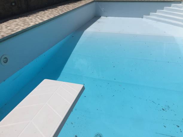 istock Empty swimming pool stair and trampoline 959942212