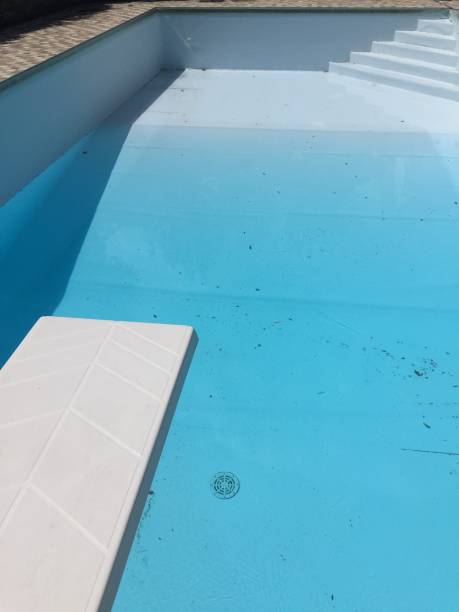 istock Empty swimming pool stair and trampoline 959942260