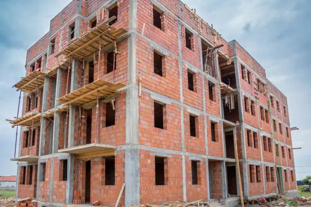 Unfinished brick house or building, still under construction. Close up.