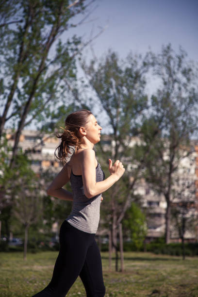istock Young athlete running in park 959950586
