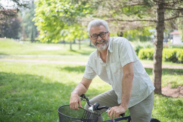 istock Senior man with bike 959956118