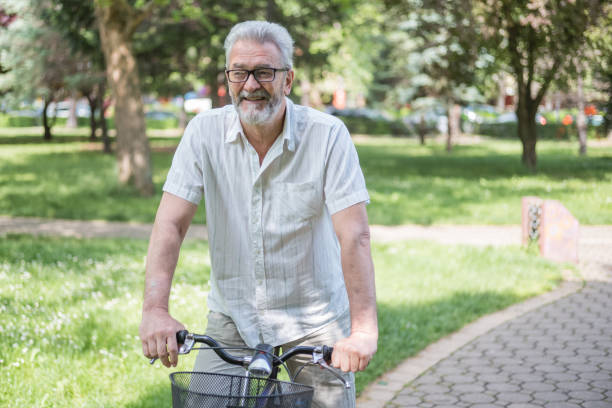 istock Senior man with bike 959956702