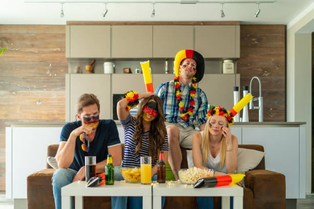 istock frustrated german soccer fans at home 959957944