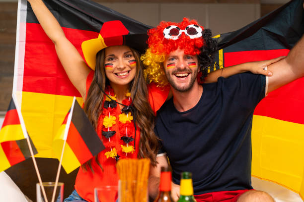 istock smiling german soccer fan couple 959960416
