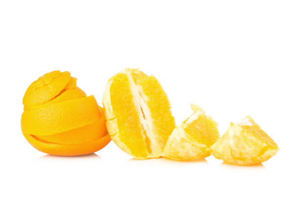 istock orange Spiral peel half slice isolated on white background 959964764