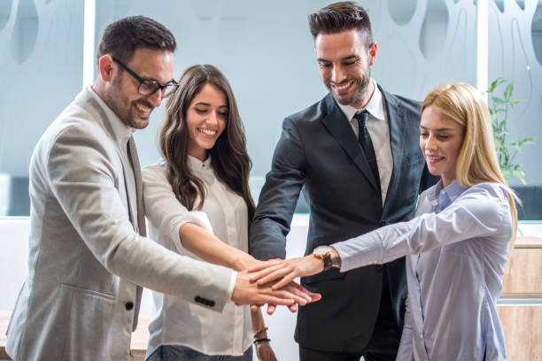 istock Business team showing unity with their hands together 959965426