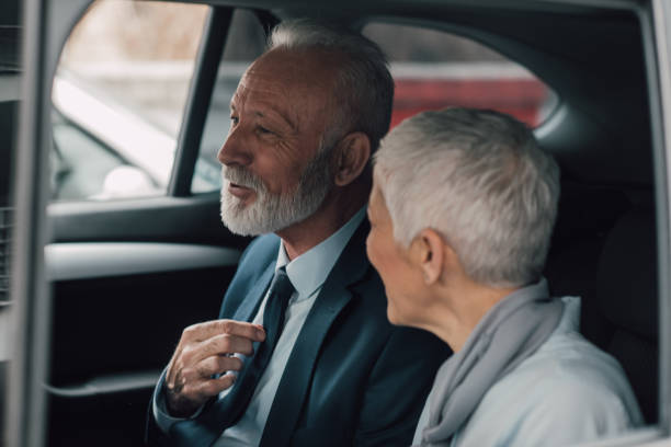 istock Elderly business people in a car 959965620