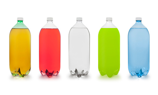 Various soda bottles flavors isolated on white (excluding the shadow)