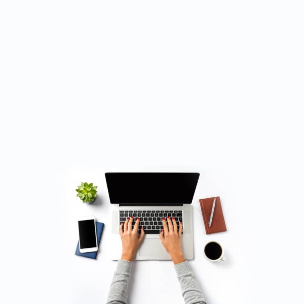 istock Woman working on laptop. Office desktop with copy space 959966162