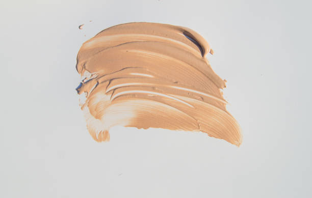 istock Beige Foundation for make-up, cosmetic touches on white background 959966398