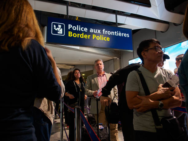 Passengers queue up at border control, Paris, France stock photo