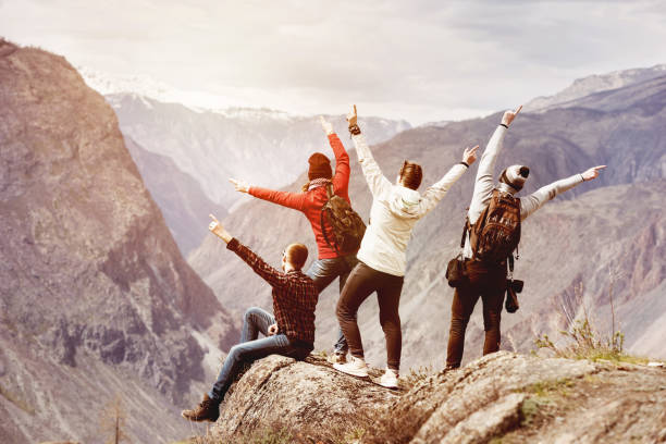 istock Happy tourists having fun mountain top 959970144