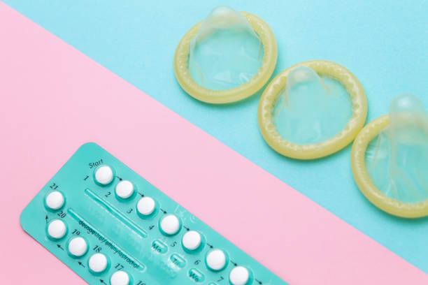 istock Contraceptive pills and condoms 959970188