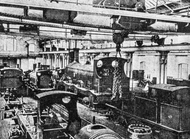 istock Two 20 ton overhead travelling cranes lifting a locomotive 959970814