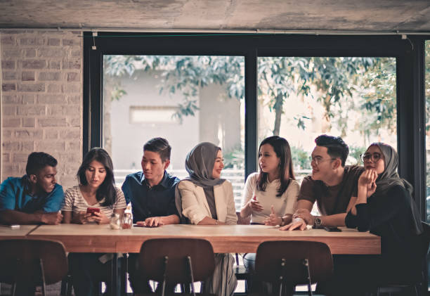 istock young adults friends gathering at cafe 959971302