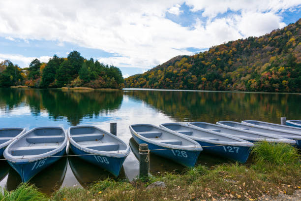 istock Boats on a blue lake and blue sky nature 959974804