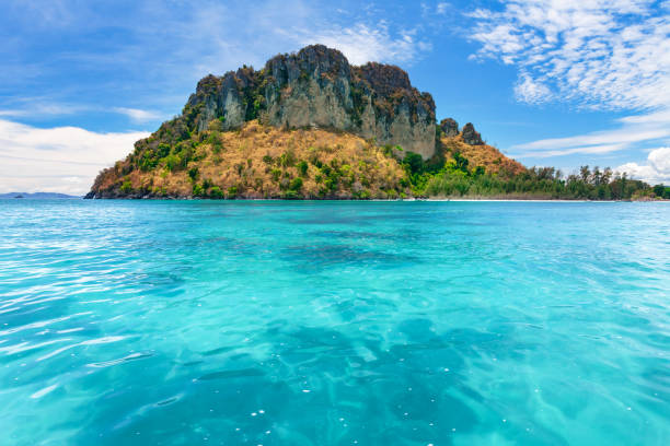 istock Tropical island in the blue ocean. Thailand 959977070