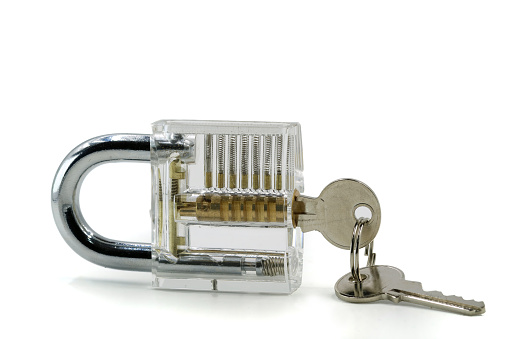 Transparent padlock with keys isolated on white background
