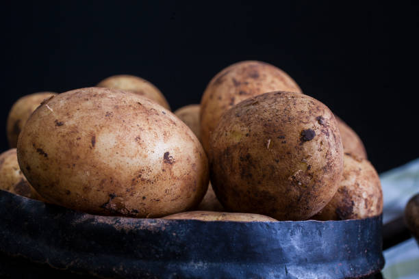 New potatoes on dark background