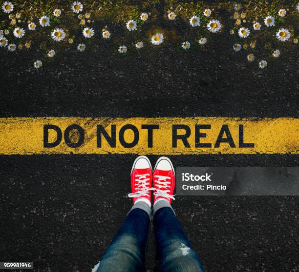 Girl Standing In Front Of The Do Not Real Sign And A Well That Scares Stock Photo - Download Image Now