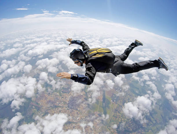 Skydiver cloudscape stock photo