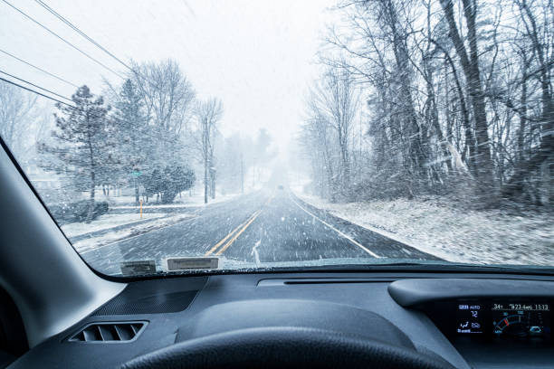 istock Car Driver POV During Winter Snow Blizzard 959984092