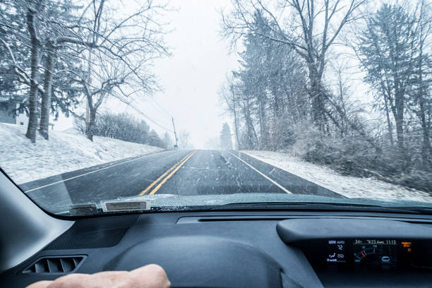 istock Winter Snow Blizzard Car Driver POV on Hilltop 959984118