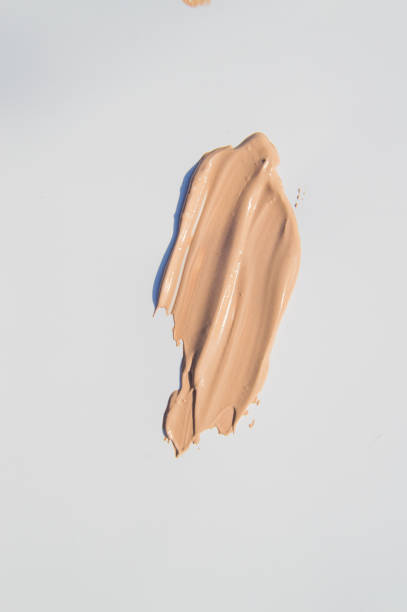 istock Smeared beige Foundation on white background, cosmetic care 959987032