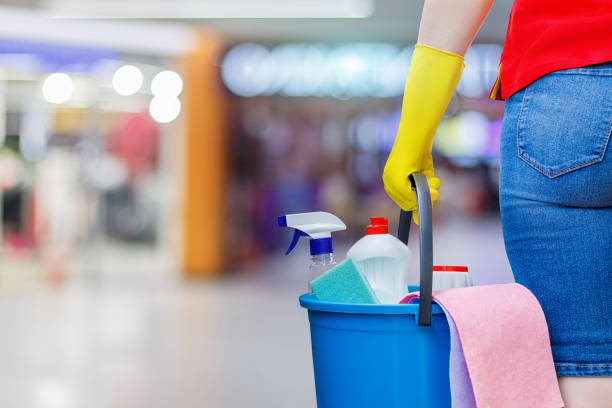istock Worker with a bucket and cleaning products . 959990458