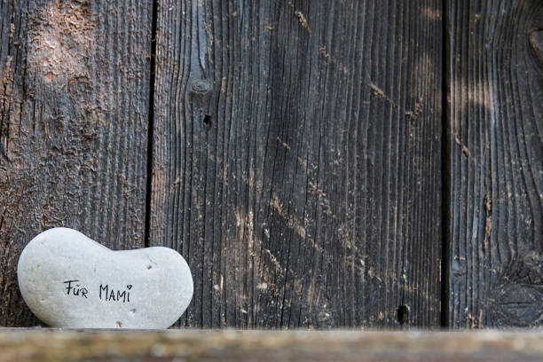 Stone heart shape on wood.