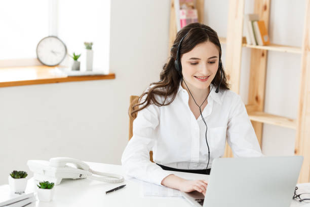 istock Call Center Concept: Portrait of happy smiling female customer support phone operator at workplace. 960001206
