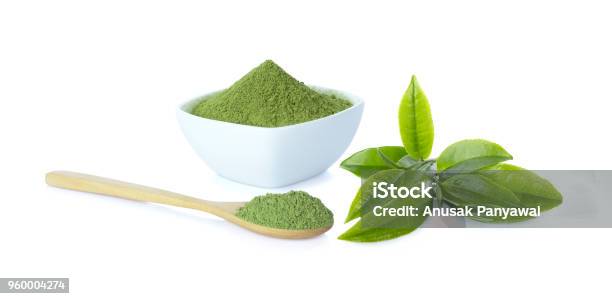 Powder Green Tea In Cup With Wooden Spoon And Green Tea Leaf On White Background And Clipping Path Stock Photo - Download Image Now