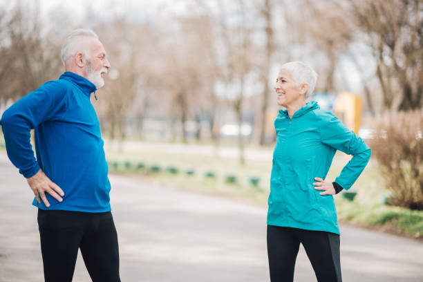 istock Athletic senior couple stretching outdoors 960011948