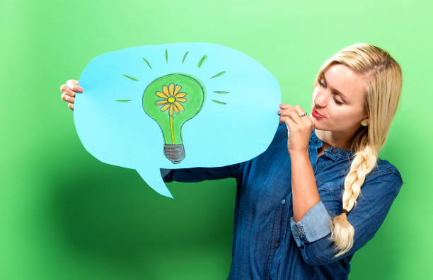 istock Eco Energy with woman holding a speech bubble 960012414