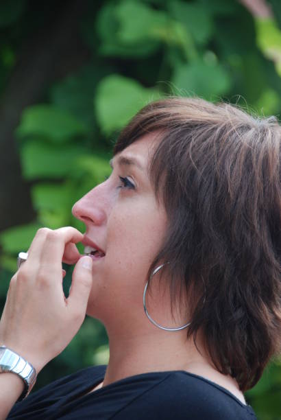 istock beautiful woman smiling and luaghing at a garden reception 960013334