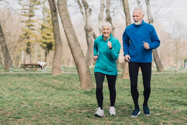 istock Athletic couple jogging outdoors 960016094
